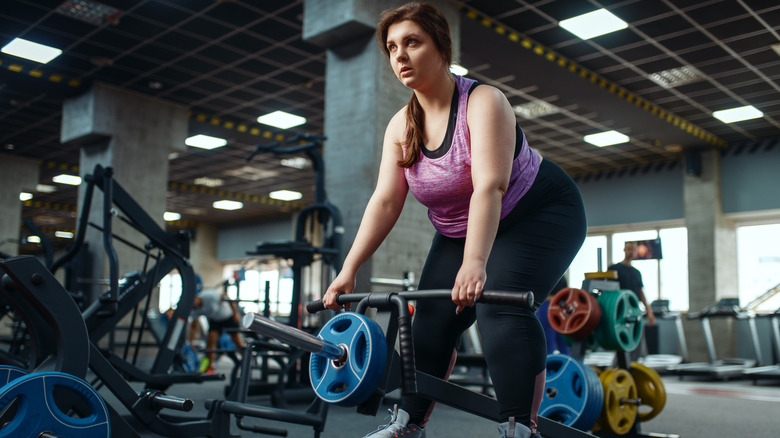 Woman exercising with weights