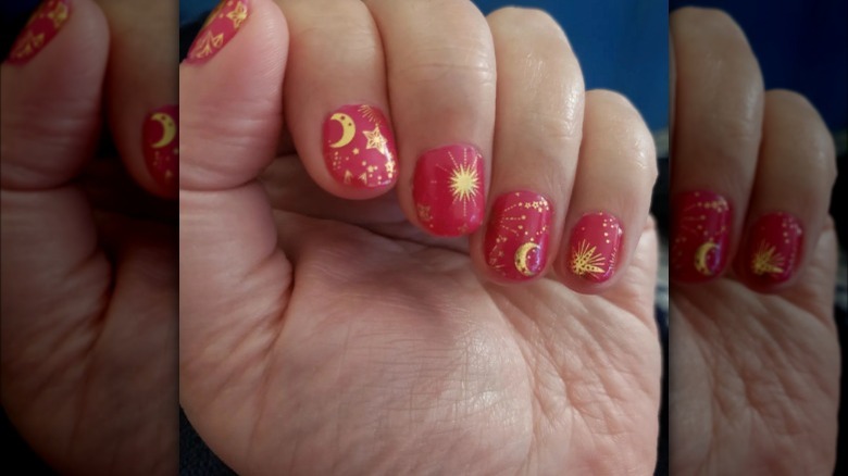 Celestial red and gold nails