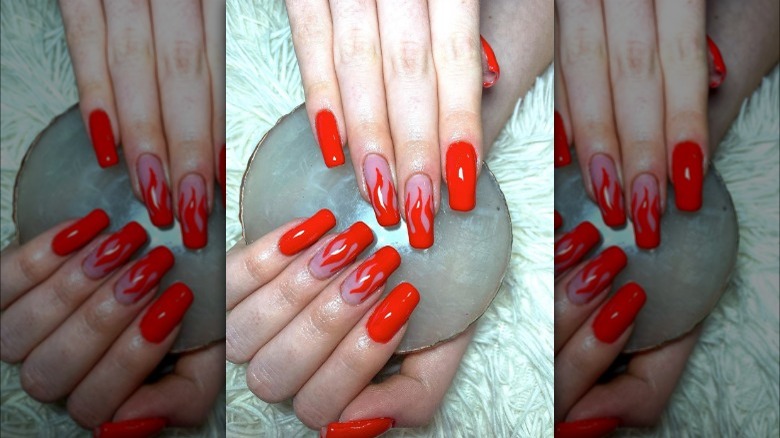 Red nails with flame design