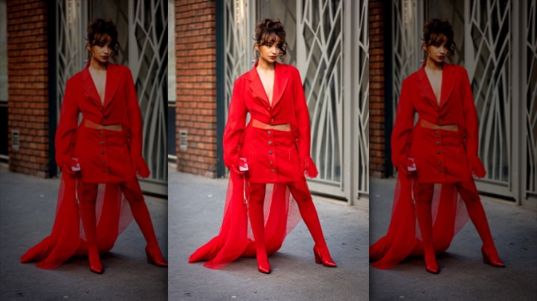 woman wearing red blazer and skirt