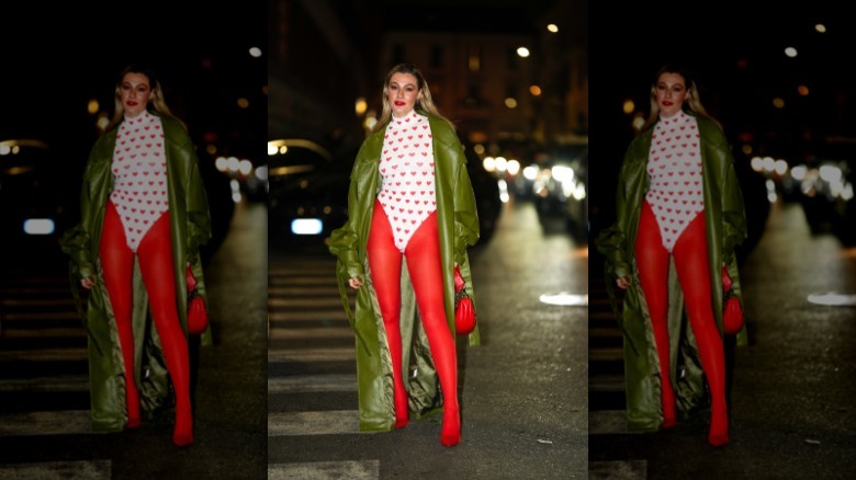 woman wearing bodysuit and red tights