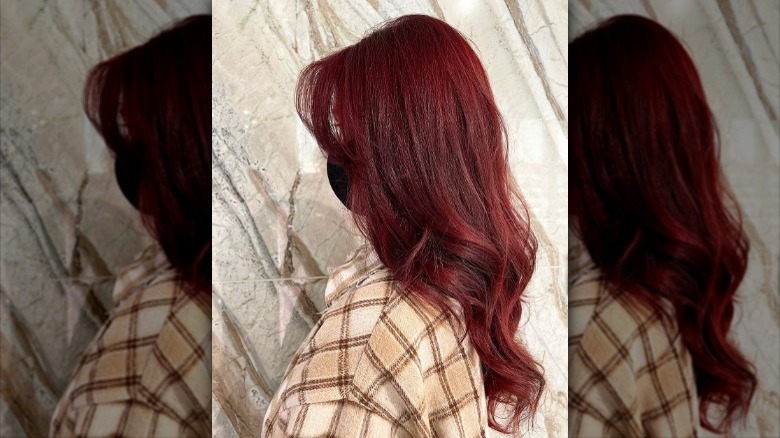 woman with layered red velvet hair