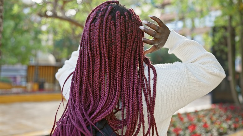 Woman with long wine-colored hair