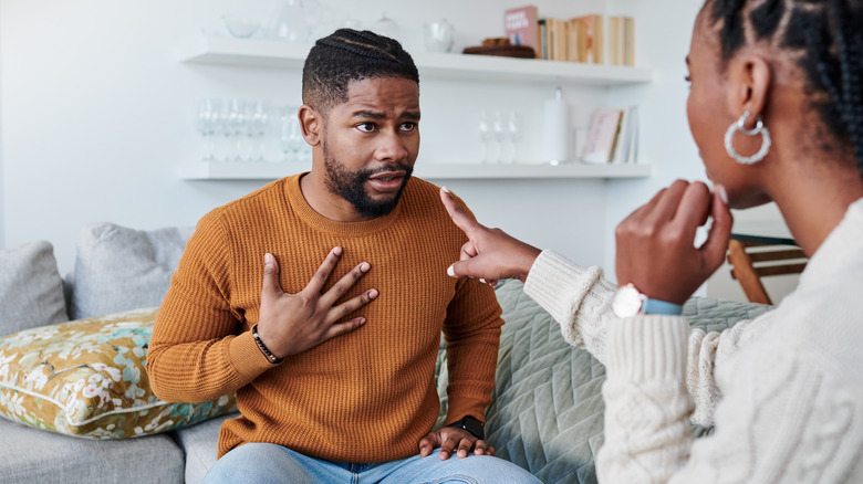 Couple taking deep breath together