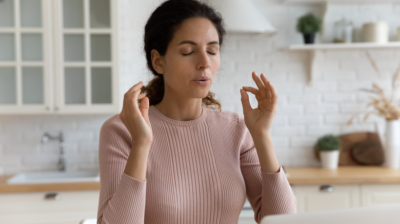 Woman take deep breath to calm herself