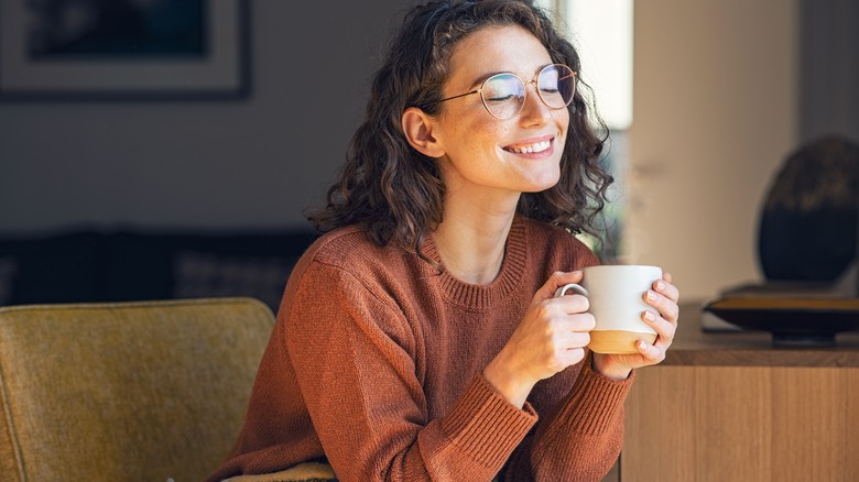 Woman relaxes with tea