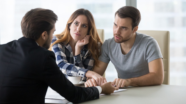 A couple meeting with a mediator