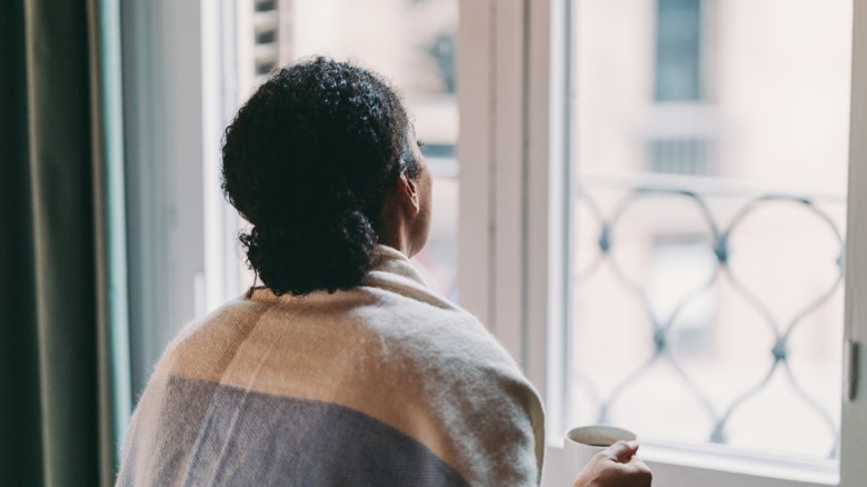 Woman looking out the window