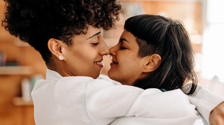 couple embracing and touching noses