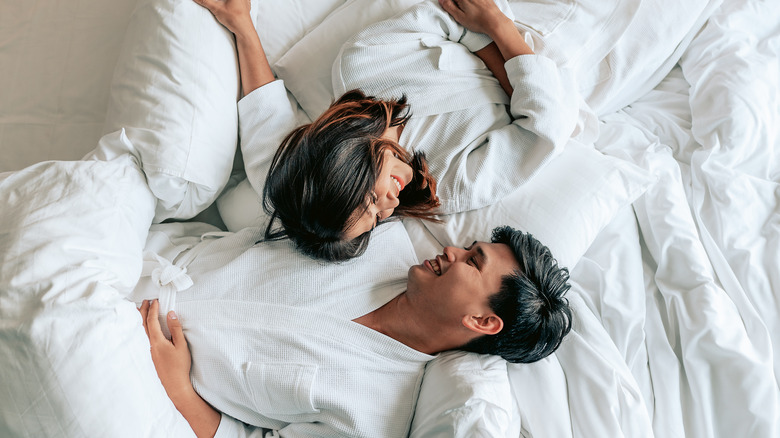 couple in white sheets