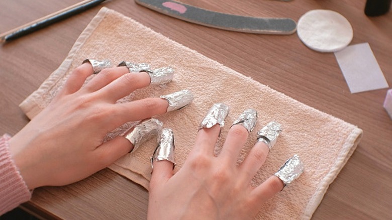 Woman with foil on fingers