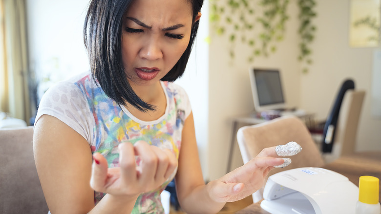 Woman upset with her nails