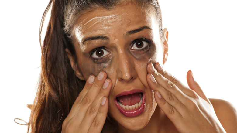 woman with running eye makeup