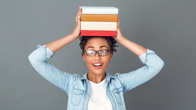 woman books on head