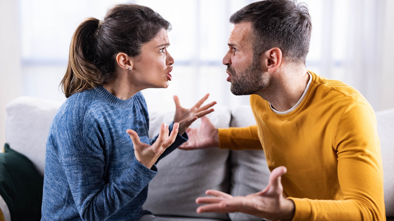 Couple arguing in their living room