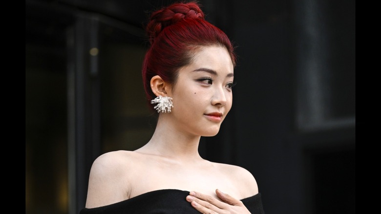 Yuyan with burgundy hair in topknot