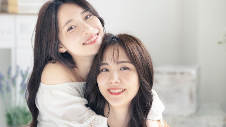 Two smiling Asian women