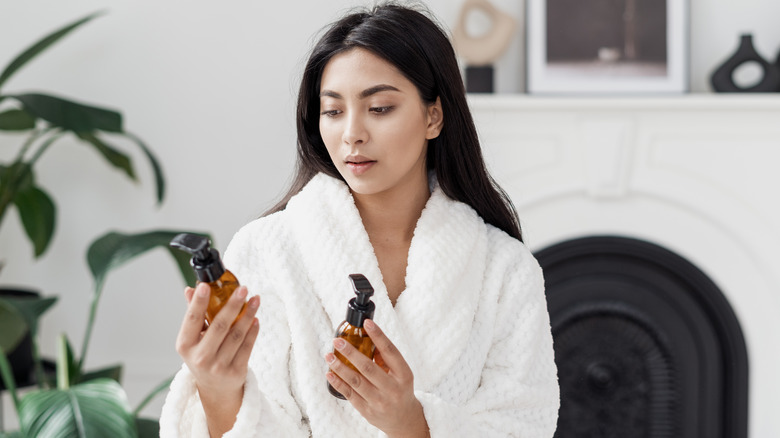 woman looking at skincare products