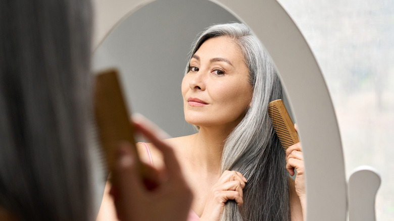 woman brushing hair 