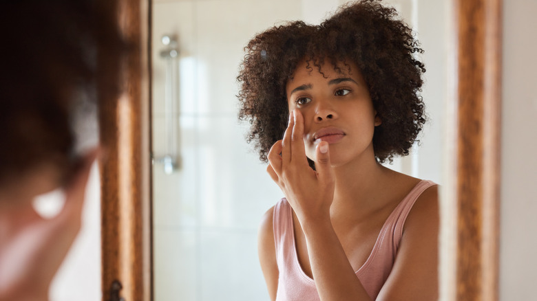 A woman doing skincare