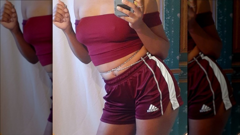 woman wearing burgundy track shorts