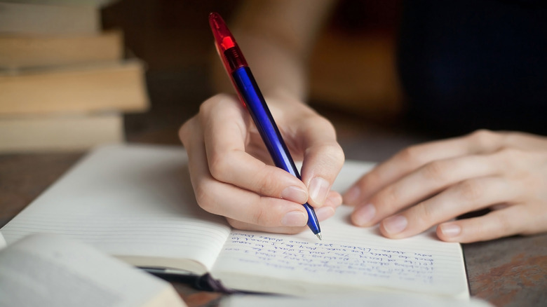 Person writing in a journal