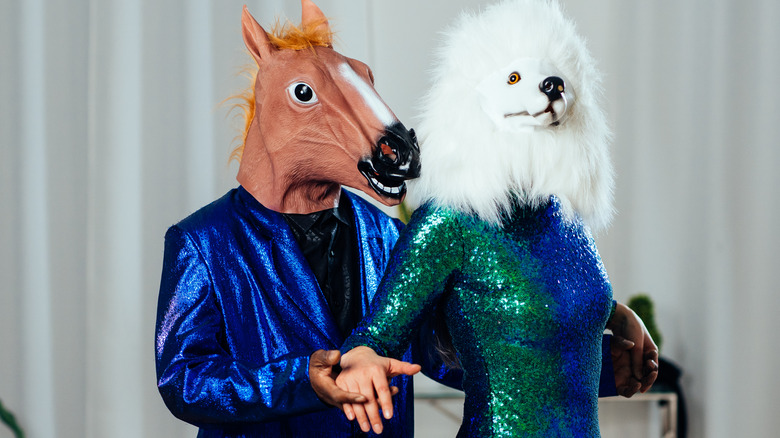 quirky couple wearing masks