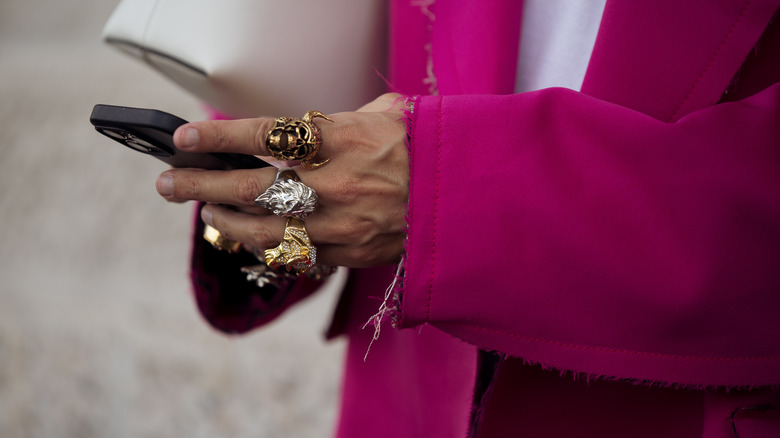 woman wearing chunky fashion rings