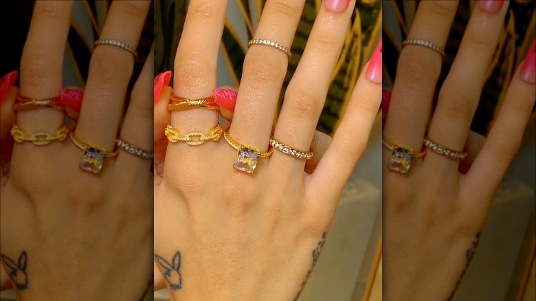woman wearing thin stacking rings