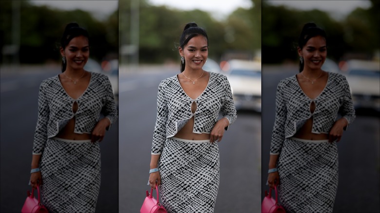 woman wearing matching top and skirt set