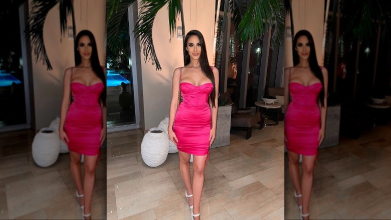 Woman wearing pink bodycon dress