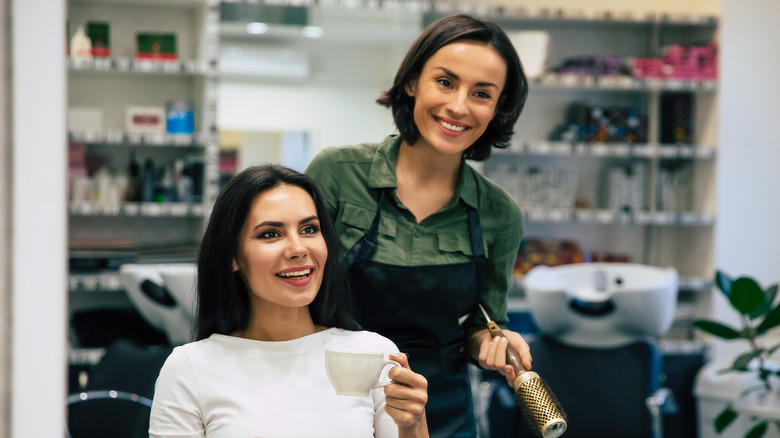 woman talking to hairdresser