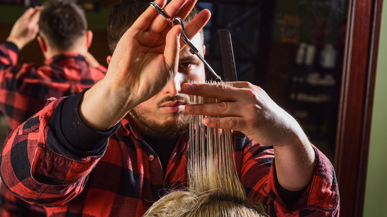 hairdresser cutting hair 