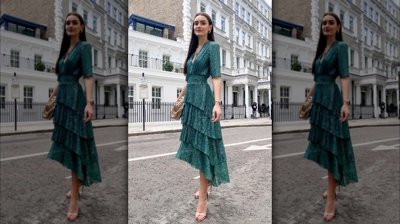 woman in green ruffled dress