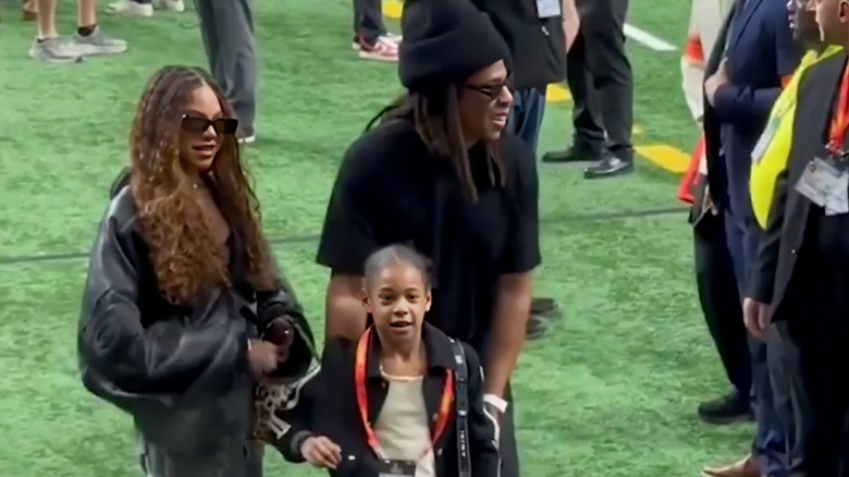 Jay-Z with his daughters, Blue Ivy and Rumi Carter, at the 2025 Super Bowl