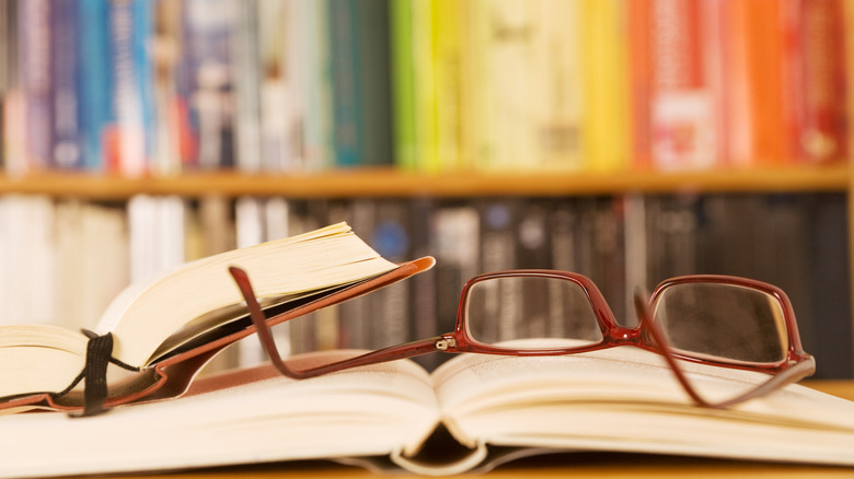 Colorful books with glasses