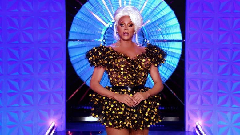 RuPaul in a black and yellow dress