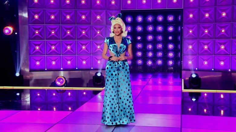 RuPaul in a polka dotted jumpsuit