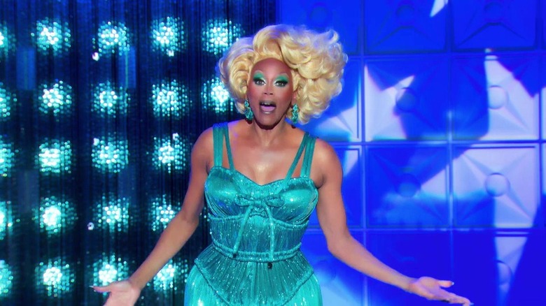 RuPaul in a teal dress