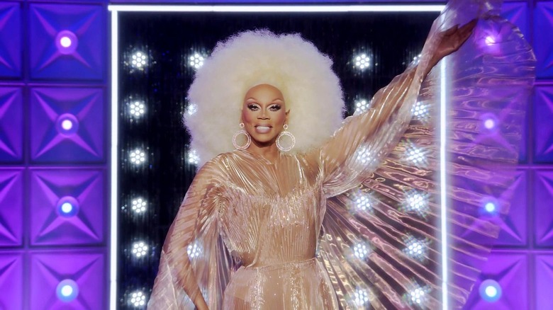 RuPaul in a shiny nude outfit