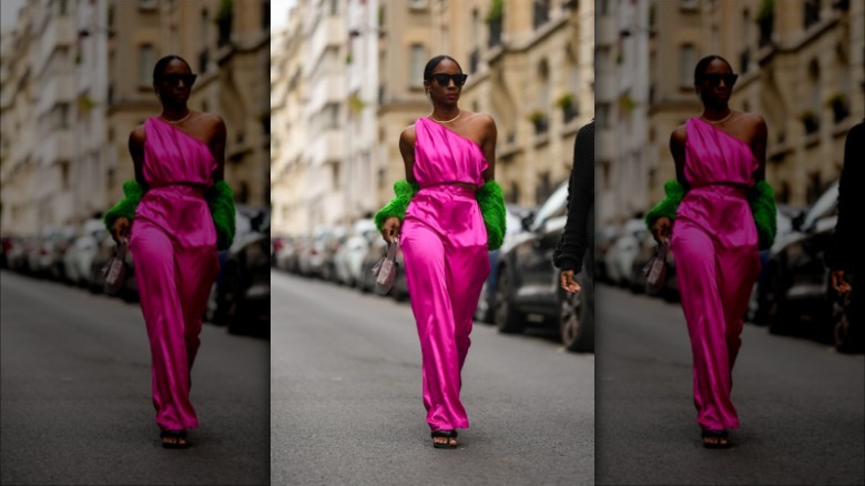 woman wearing pink satin pants