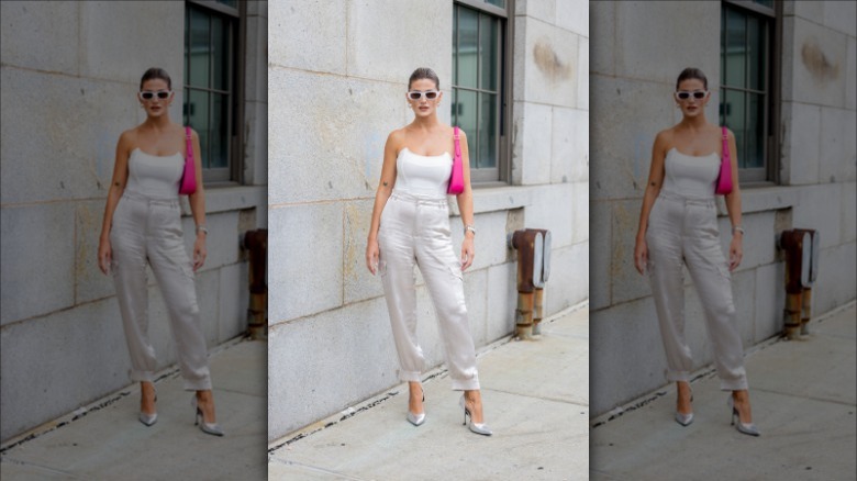 woman wearing beige satin pants