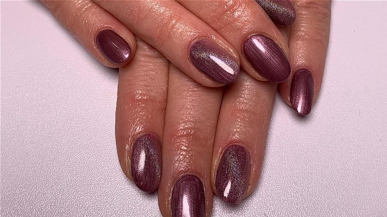 close up of purple satin nails