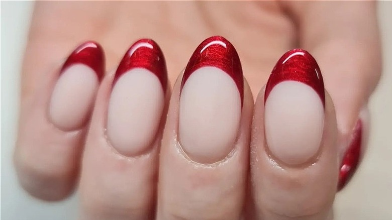 close up of red French manicure 