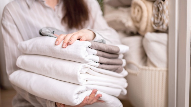 Woman holding linens