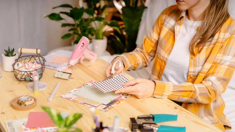 Woman making scrapbook