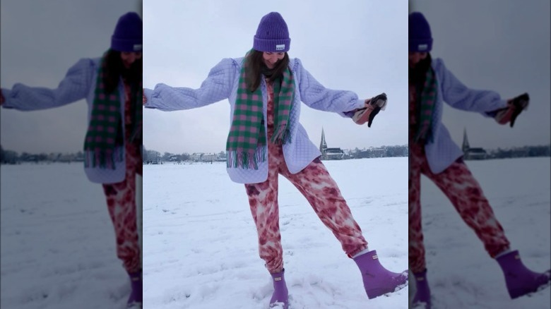 A woman wearing a colorful winter outfit