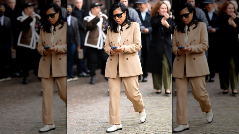 Woman wearing khaki pantsuit