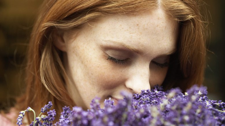 Woman smelling flowers