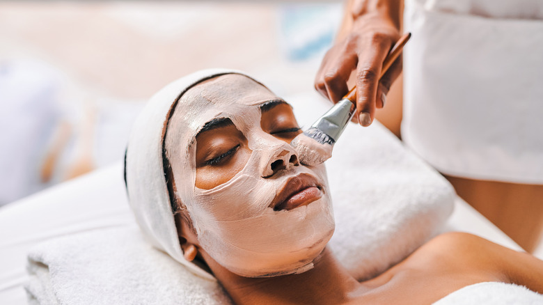 woman with clay mask